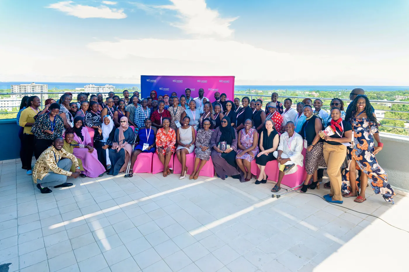 WEConnect summit delegates group photo on a rooftop terrace