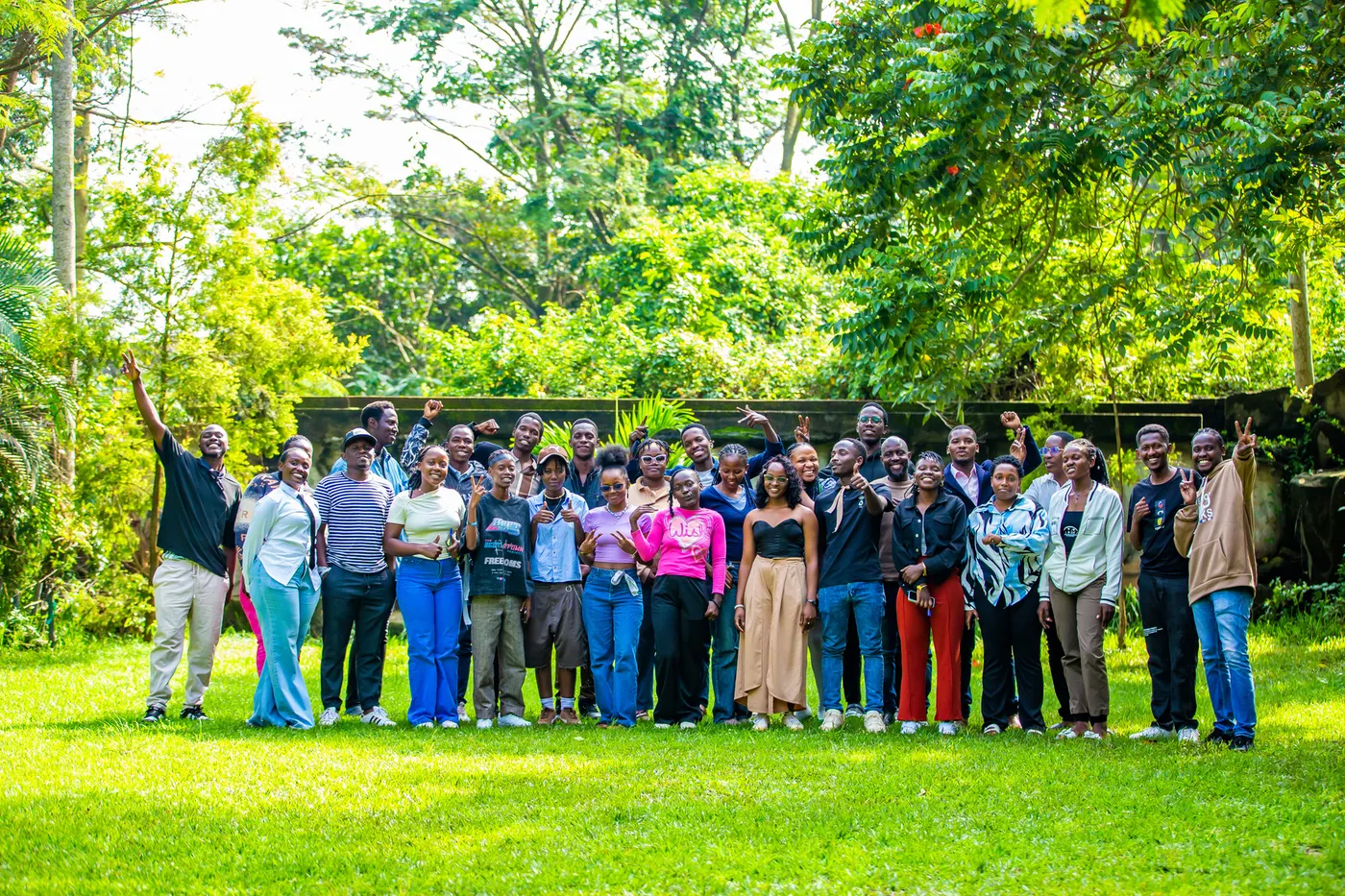 Youth group photo on a lawn after a session